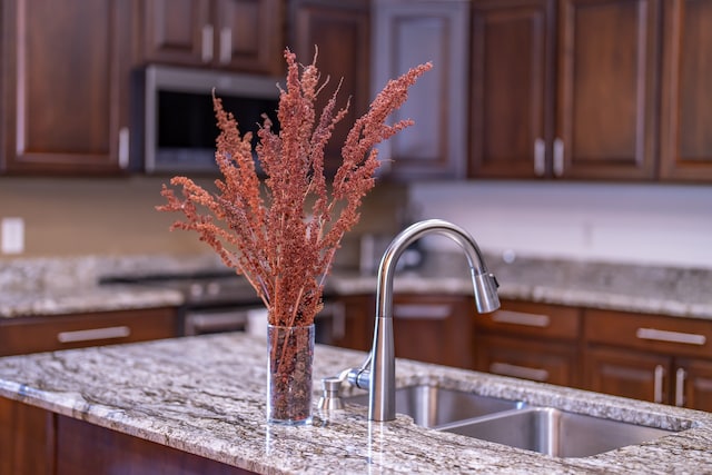 interior details with light stone counters and sink