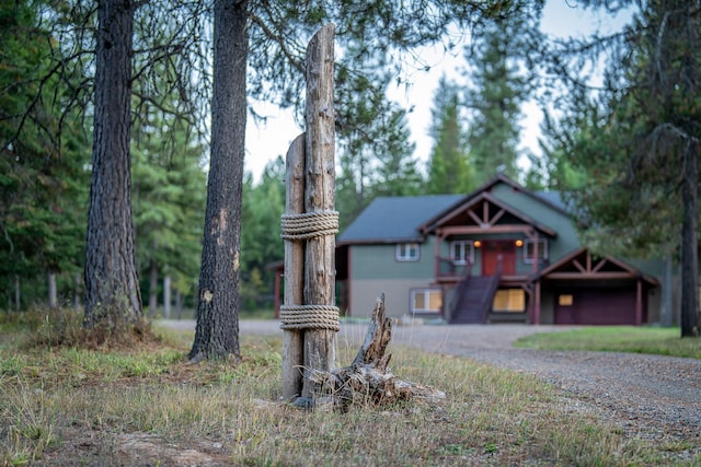 44 Copper Ridge Rd, Trout Creek, MT 59874 - rustic home with gravel driveway and a garage