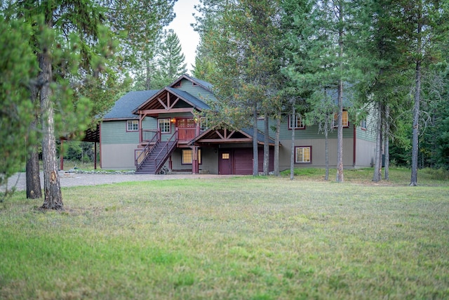 44 Copper Ridge Rd, Trout Creek, MT 59874 - view of front of home with a front lawn, a wooden deck, and stairs