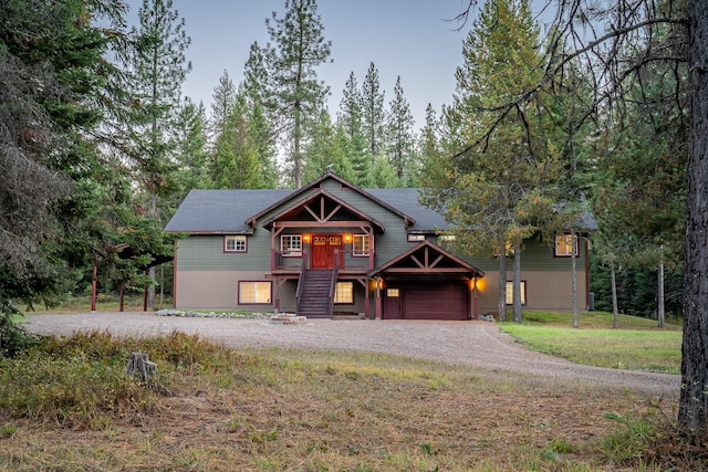 44 Copper Ridge Rd, Trout Creek, MT 59874 - view of front of house featuring an attached garage and dirt driveway
