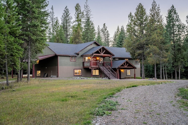 44 Copper Ridge Rd, Trout Creek, MT 59874 - view of front of property featuring a wooden deck, a front lawn, stairs, and gravel driveway
