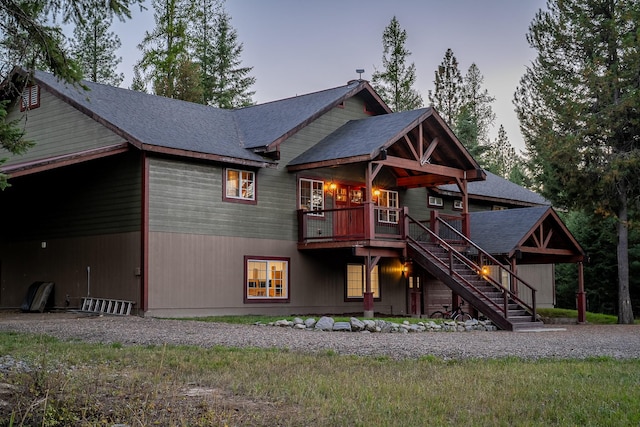 44 Copper Ridge Rd, Trout Creek, MT 59874 - rear view of property featuring a wooden deck, roof with shingles, and stairway