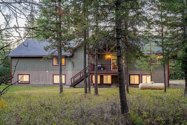 44 Copper Ridge Rd, Trout Creek, MT 59874 - back of property with stairway and a wooden deck