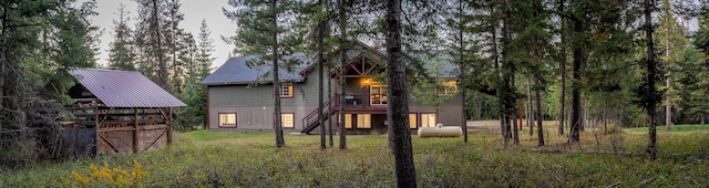 44 Copper Ridge Rd, Trout Creek, MT 59874 - back of property featuring a lawn and stairs