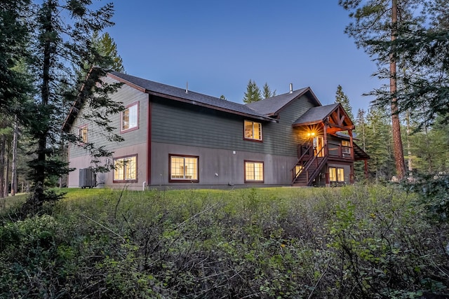 44 Copper Ridge Rd, Trout Creek, MT 59874 - rear view of property with a wooden deck and stairway