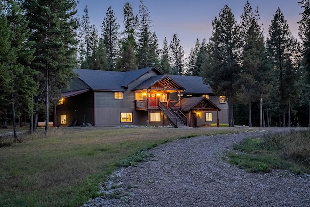 44 Copper Ridge Rd, Trout Creek, MT 59874 - view of front facade with stairway, gravel driveway, and a deck