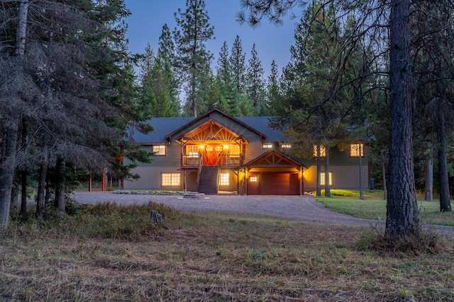 view of front of property with a front yard and a garage