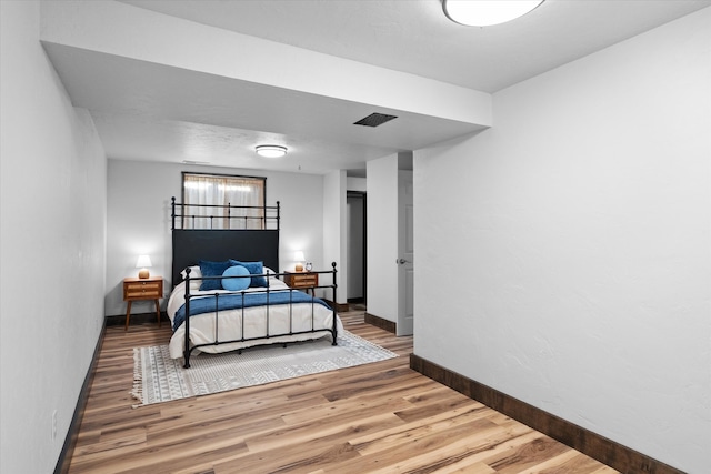 bedroom featuring wood-type flooring