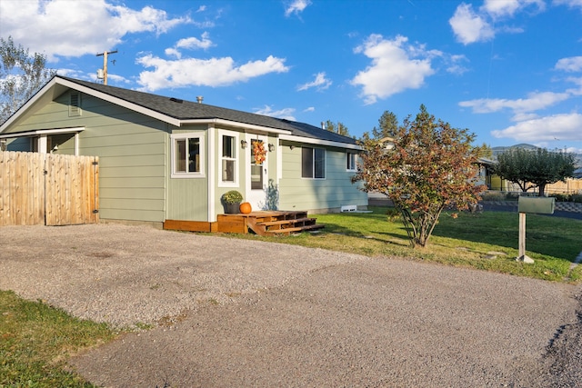 single story home with a front yard