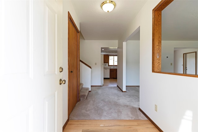 hallway with light carpet