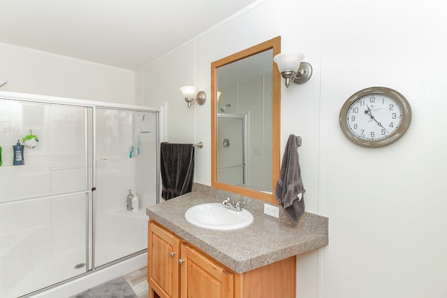 bathroom with vanity and an enclosed shower