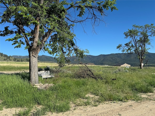 mountain view featuring a rural view