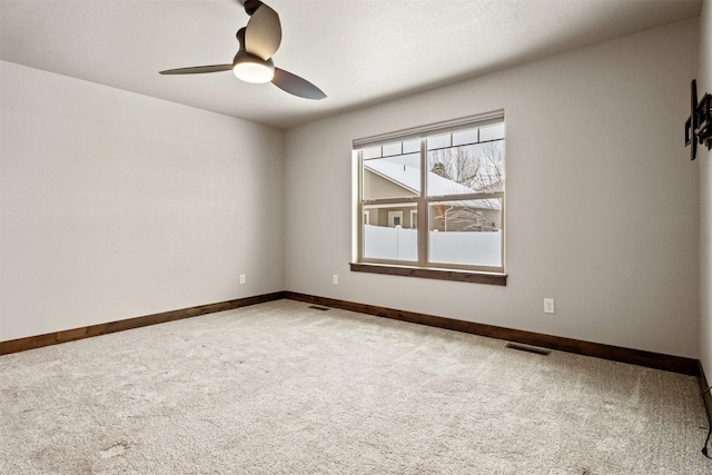 unfurnished room with ceiling fan, carpet floors, and a textured ceiling