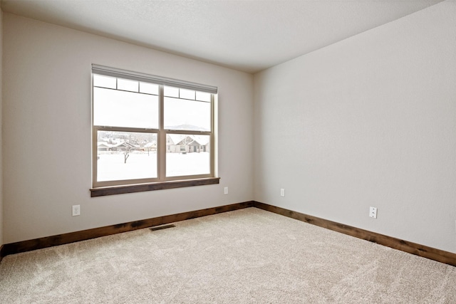 unfurnished room featuring carpet floors