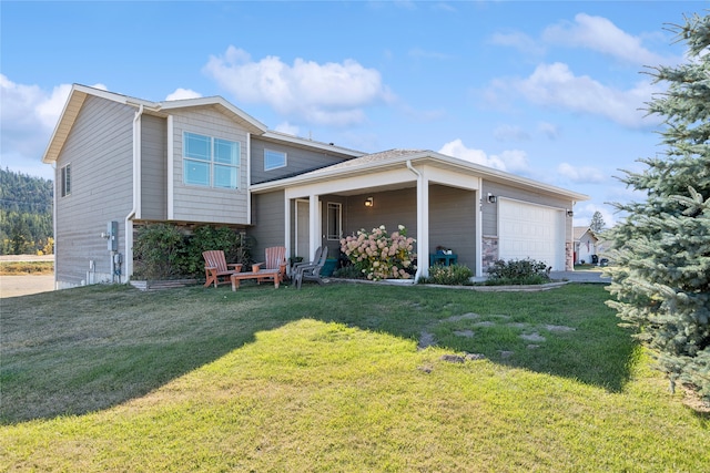 view of front of home featuring a garage and a front yard