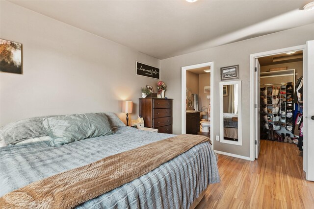28 W Ashley Hills Dr, Kalispell, MT 59901 - bedroom with a spacious closet, light wood-style floors, and a closet
