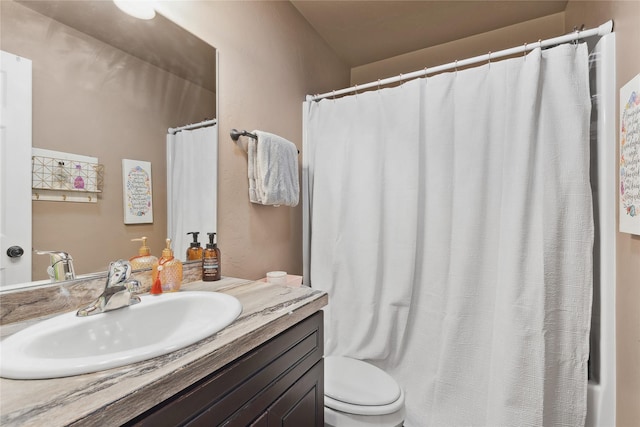 28 W Ashley Hills Dr, Kalispell, MT 59901 - full bathroom featuring toilet, vanity, and a shower with shower curtain