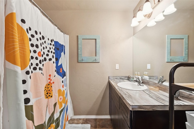 28 W Ashley Hills Dr, Kalispell, MT 59901 - full bath featuring vanity, tile patterned flooring, baseboards, and curtained shower