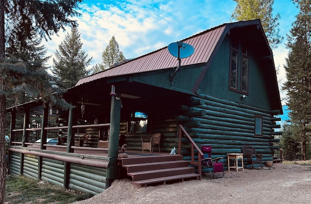 rear view of house with covered porch