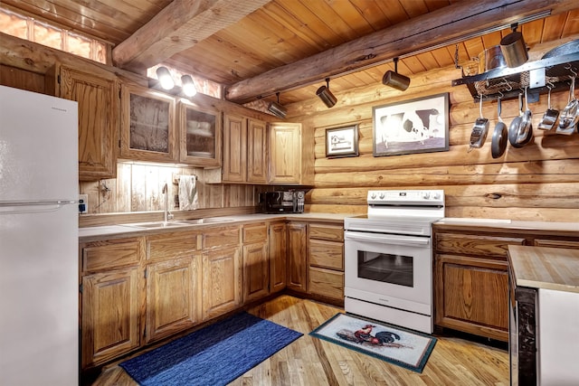 kitchen with wooden ceiling, white appliances, sink, light hardwood / wood-style flooring, and beam ceiling