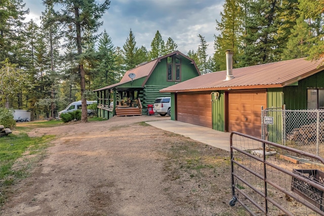 view of front facade with an outbuilding and a garage