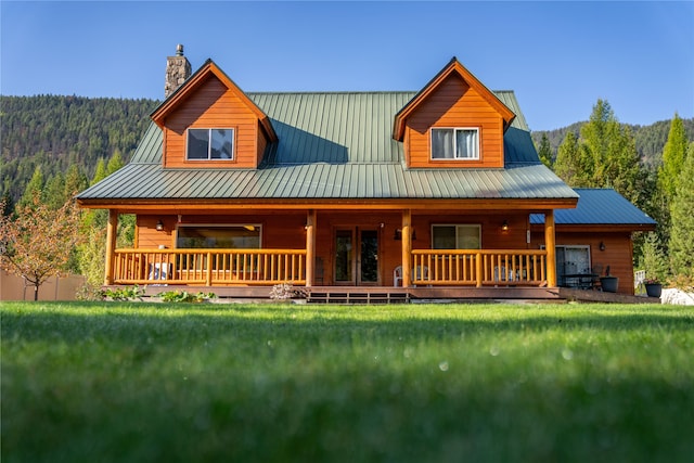 log cabin with a front yard