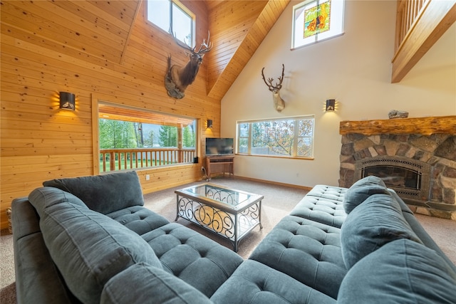 living room with plenty of natural light, carpet flooring, and high vaulted ceiling