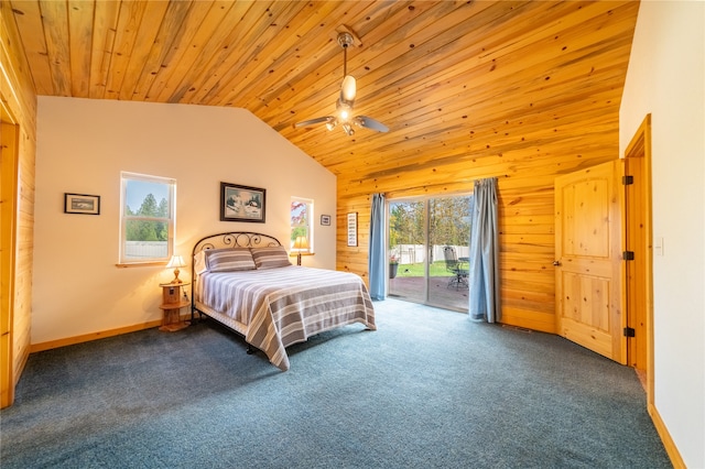 bedroom with multiple windows, wood walls, and access to outside