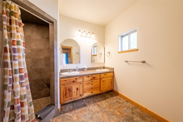 bathroom with vanity and curtained shower