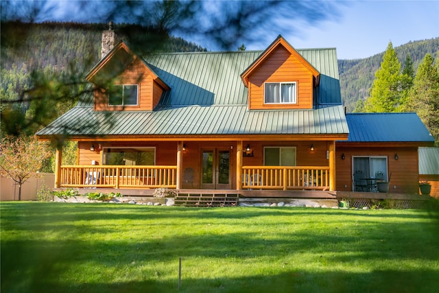 view of front of house with a front lawn and covered porch