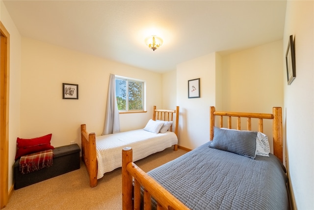 bedroom with light carpet