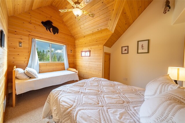 bedroom featuring wood walls, carpet flooring, ceiling fan, wooden ceiling, and high vaulted ceiling