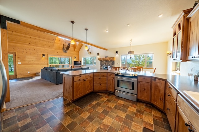 kitchen with kitchen peninsula, wooden walls, lofted ceiling with beams, electric range, and a fireplace