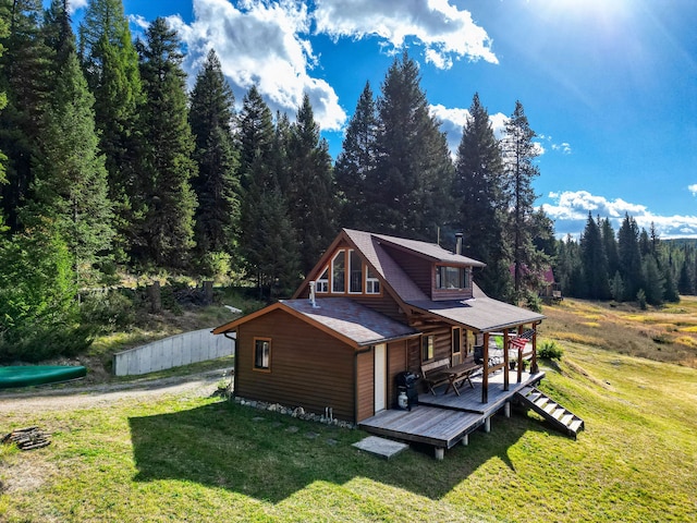 exterior space with a lawn and a deck