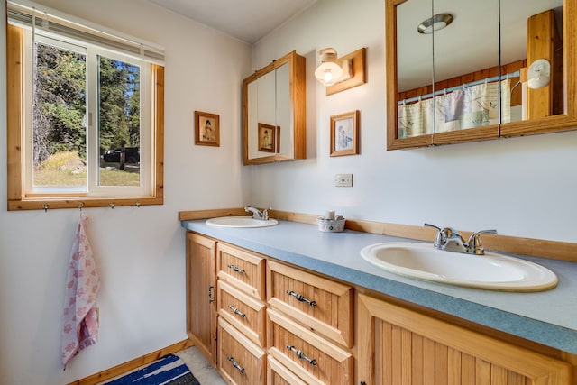 bathroom featuring tile patterned flooring and vanity