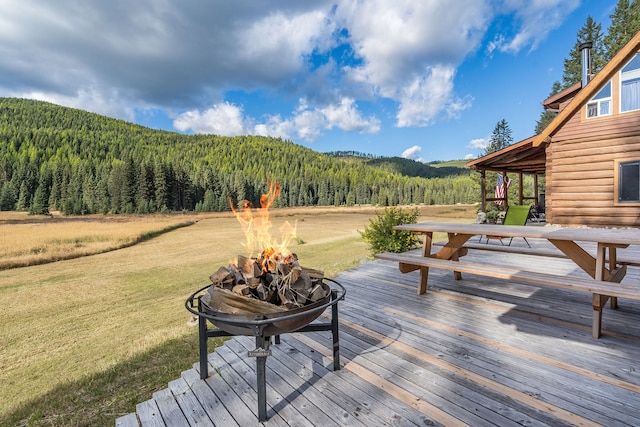 wooden deck with a lawn