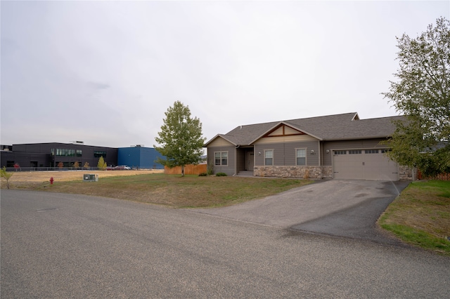 view of front facade with a garage and a front lawn