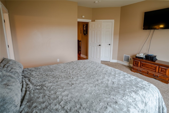 bedroom featuring light colored carpet