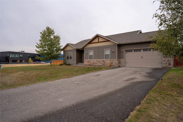 view of front of home featuring a garage and a front yard