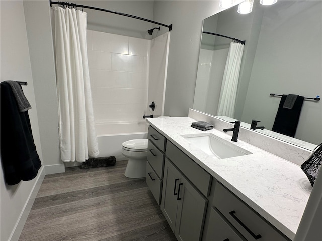 full bathroom with toilet, hardwood / wood-style flooring, vanity, and shower / bathtub combination with curtain