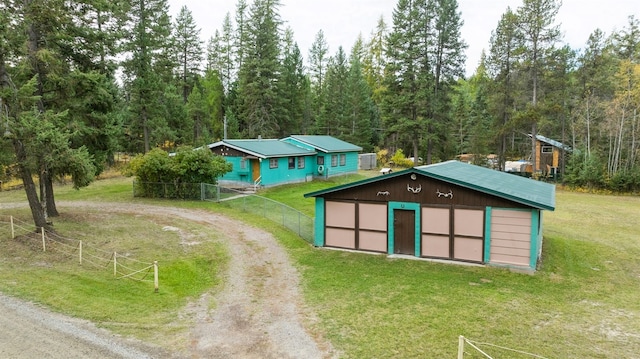 exterior space with a lawn and a garage