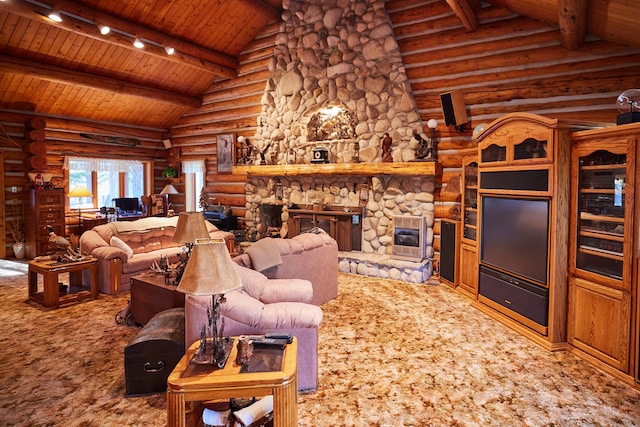 living room featuring a stone fireplace, log walls, rail lighting, wood ceiling, and vaulted ceiling with beams