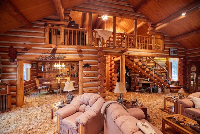 living room with log walls and wooden ceiling