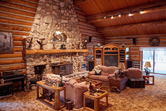 living room featuring wood ceiling, beam ceiling, a stone fireplace, track lighting, and log walls