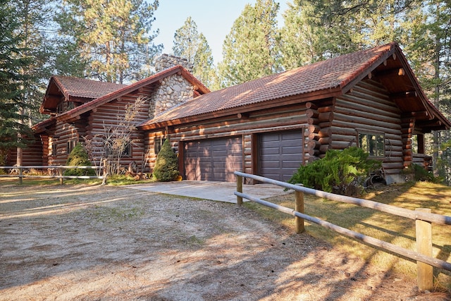 view of side of property with a garage