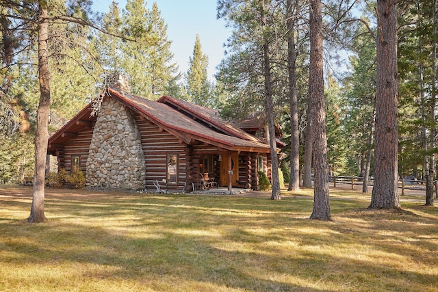 view of side of home featuring a yard