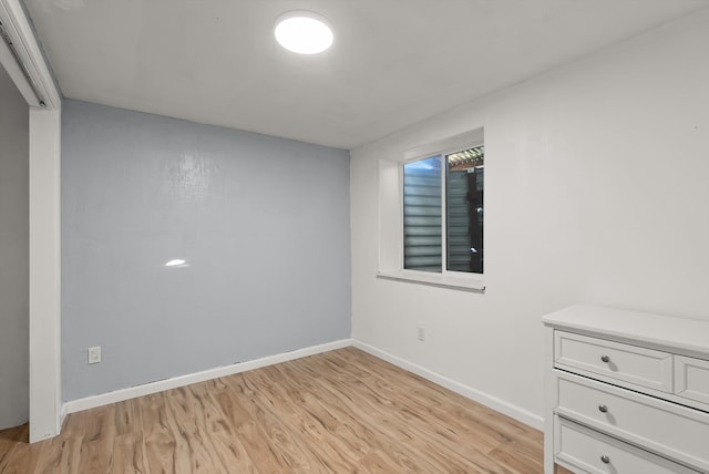 unfurnished room featuring light wood-type flooring