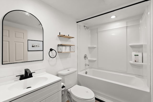 full bathroom featuring tub / shower combination, vanity, and toilet