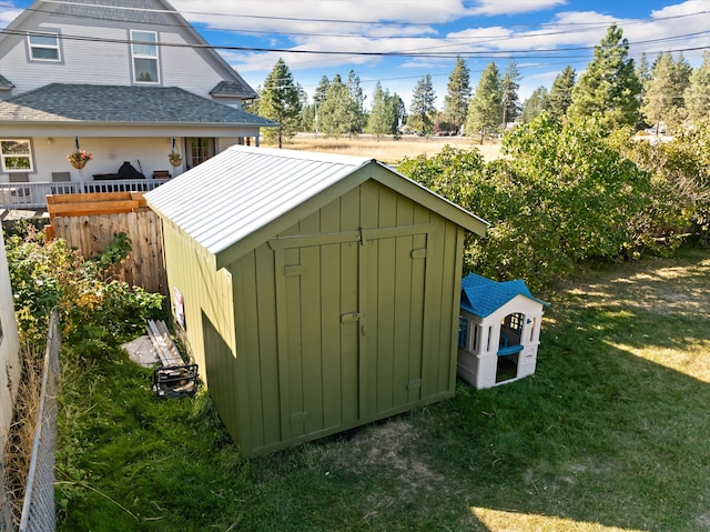 view of outbuilding with a yard