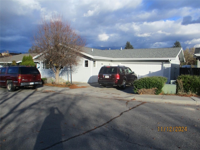 view of front of property with a garage